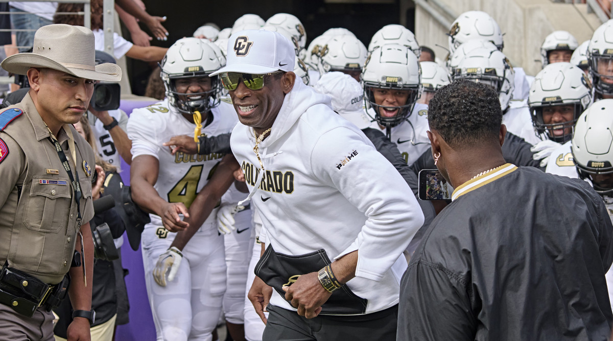 Deion Sanders leading Colorado out.